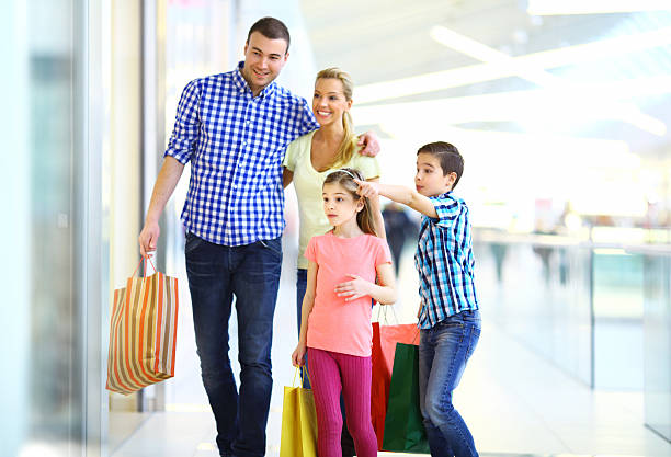 istock Smiling family shopping together 470929019