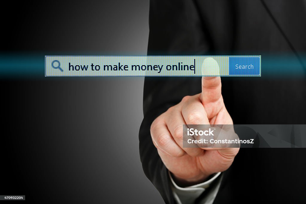 how to make money online male hand pressing a how to make money online search bar, internet concept 2015 Stock Photo