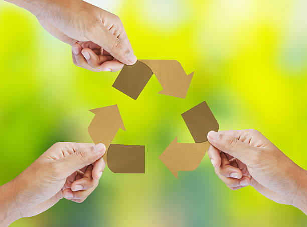 istock Paper recycle sign in hands 470933511