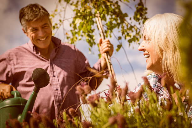 istock Happy mature couple gardening together 470934018