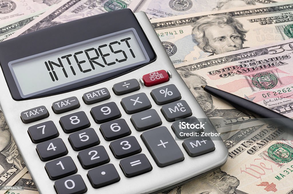 Calculator with money - Interest Interest Rate Stock Photo