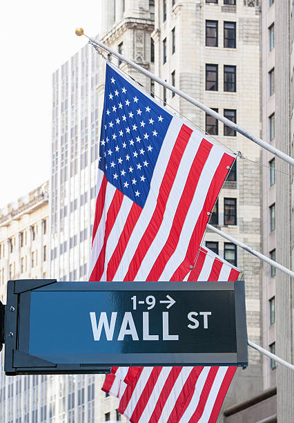 istock Wall Street sign with American Flags. 470937316