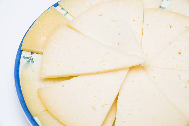 istock plate with slices of spanish manchego cheese 470937801