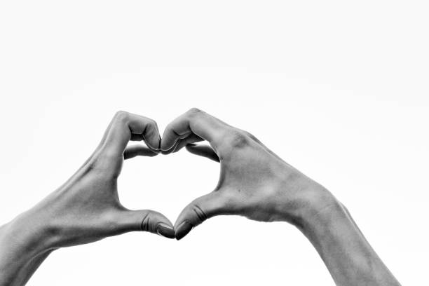 istock heart symbol made with two hands on the sky 470938470