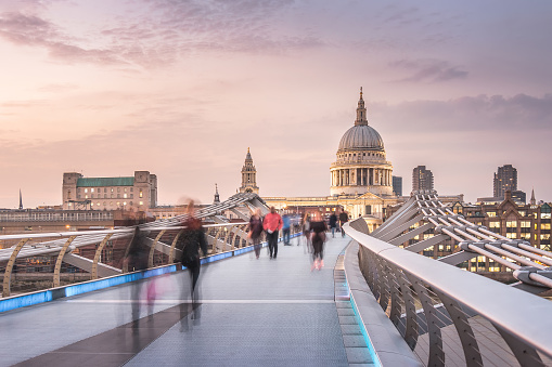 The Millennium Bridge to the St Paul's Cathedral in Twilight with Moving People