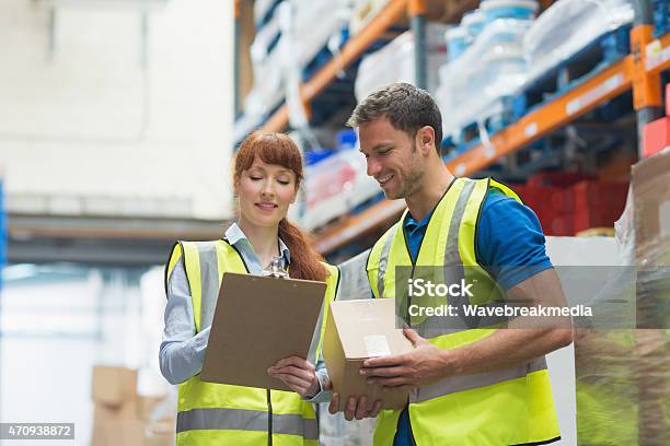 Smiling Warehouse Manager And Delivery Man Stock Photo - Download Image Now - Men, Warehouse, 2015