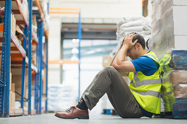istock Tired man sitting on the couch with a headache 470938896