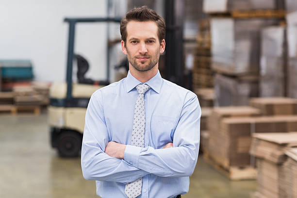 istock Serious manager with arms crossed in warehouse 470942344