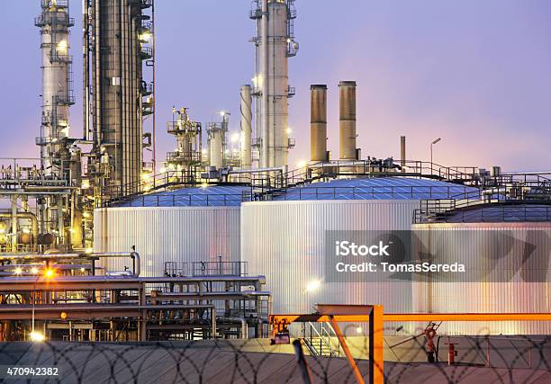 Oil Tank At Night Stock Photo - Download Image Now - Chemical Plant, Oil Refinery, Fuel Storage Tank