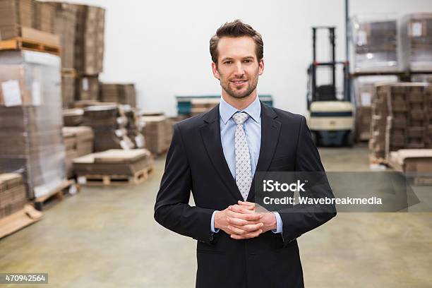 Warehouse Manager Standing Hands Together Stock Photo - Download Image Now - 20-29 Years, 2015, 25-29 Years
