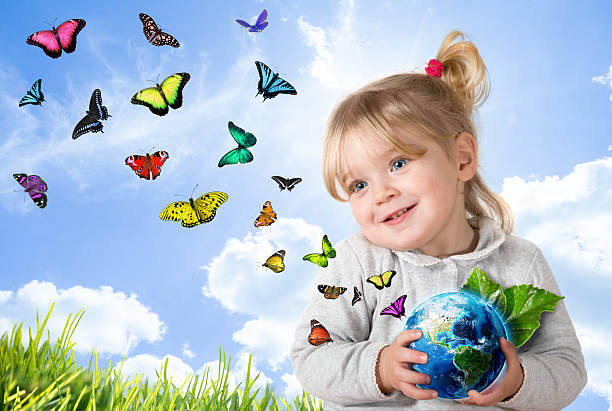 istock little girl holding earth - environment concept 470943096