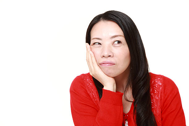istock Japanese woman suffers from toothache 470943386