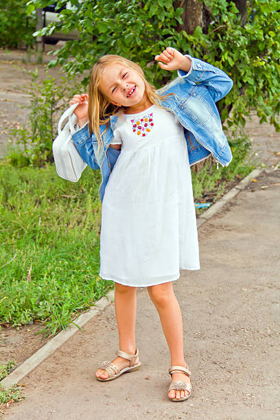 istock Cute girl playing with white bag 470947076