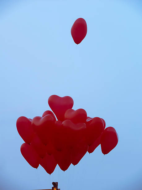 istock Red colored Heart shaped Balloons in air 470947572