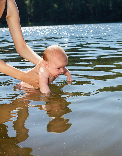 istock Baby bathing outdoor 470947632