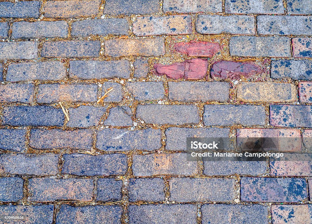 Multicolored brick abstract background texture Multicolored brick cobblestones abstract background texture with rich vibrant shades of gray red orange blue and pink. Taken in Victorian Village, Columbus, Ohio USA Columbus - Ohio Stock Photo