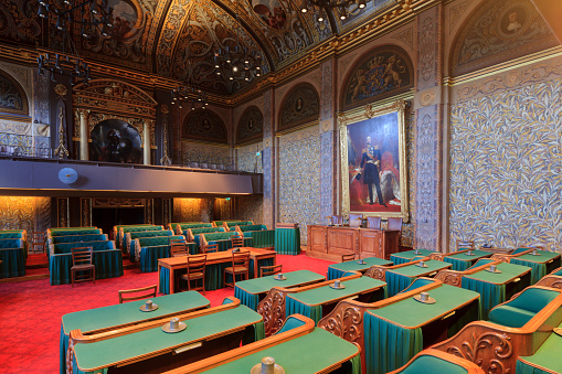 The Hague, Netherlands - September 16, 2014: interior of the First Chamber (in Dutch: Eerste Kamer), also known as the Senate, the upper house of the States General, the legislature of the Netherlands. Its 75 members are elected by the members of the regional authorities of the twelve provinces every four years. The First Chamber is located on Binnehof in The Hague.