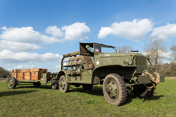 istock Military jeep pulling trailer carrying wooden boxes with bullets 470954160