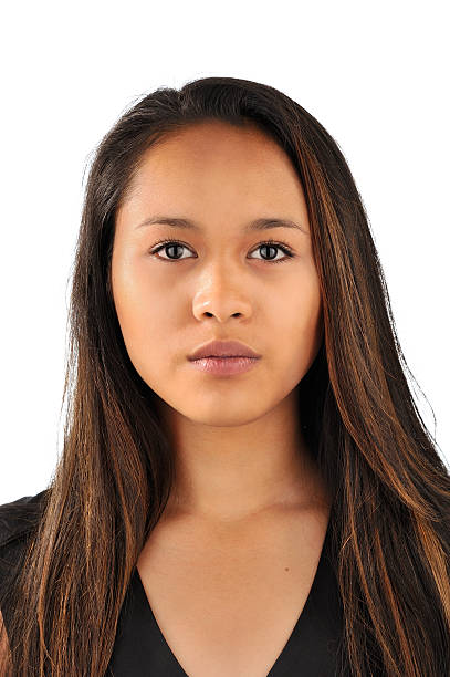 photobooth picture of a young woman Portait of a young south american woman with long hair on a white background, studio shot. passport photos stock pictures, royalty-free photos & images