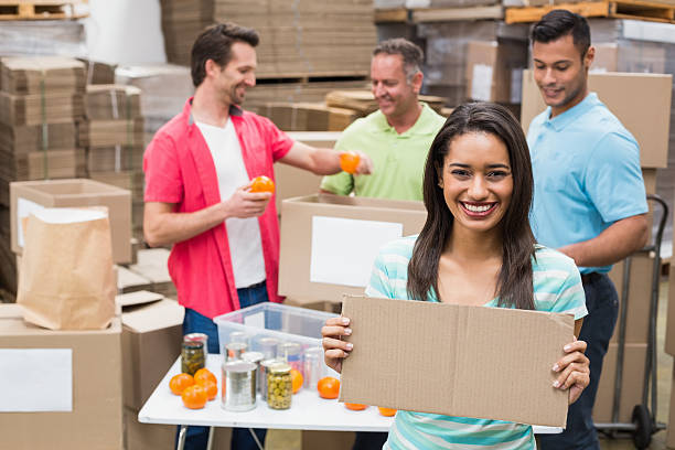 istock Smiling volunteer showing a poster 470959520