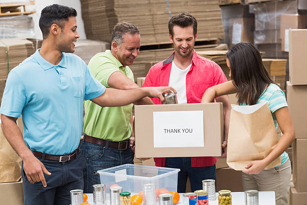 istock A group of workers in a warehouse packing up donation boxes 470959578
