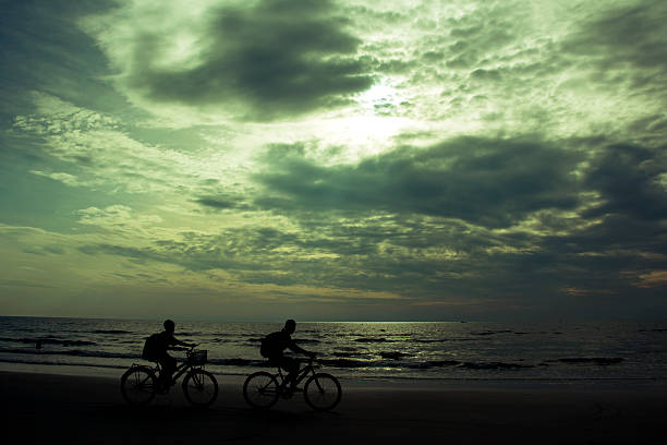 istock silhouette Children's bicycles on the beach 470962784