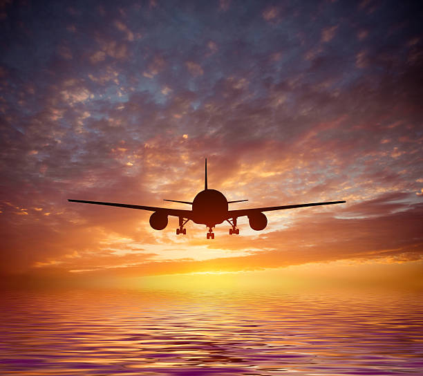 istock aircraft flies over the ocean 470962932