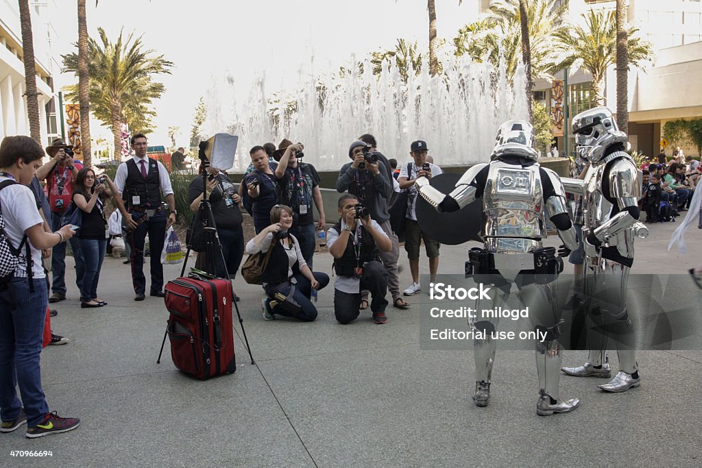 Crowd of People With Cameras Taking Pictures of Storm Troopers Anaheim, CA, USA - April 16, 2015: Crowd of People With Cameras Taking Pictures of Silver Storm Troopers at the 2015 Star Wars Costume Stock Photo