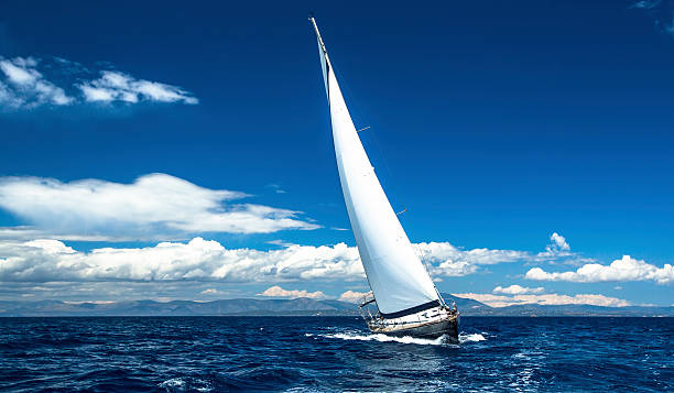 istock Sailing ship yachts with white sails in the open sea. 470967460