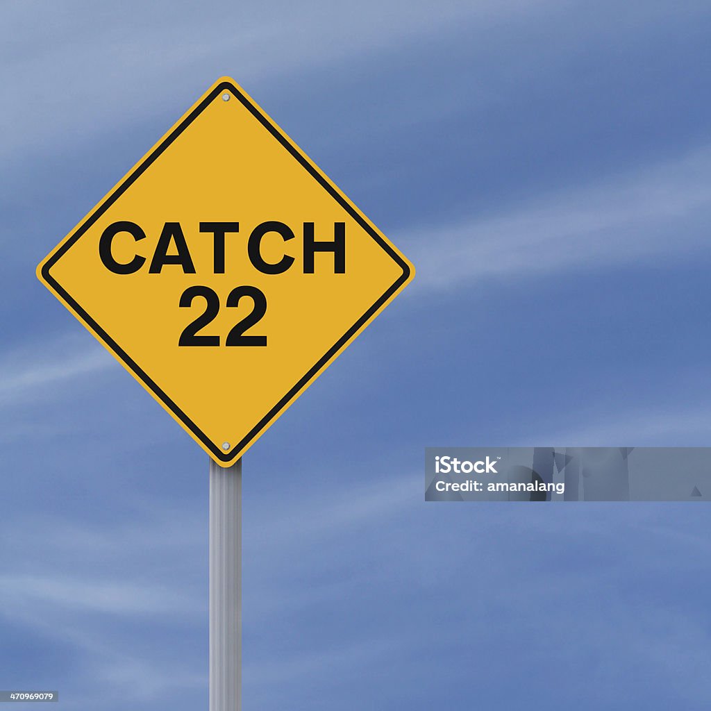 Catch 22 Ahead A modified road sign indicating Catch 22 20-24 Years Stock Photo