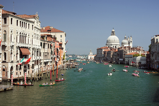 Venice is a city in northeastern Italy sited on a group of 117 small islands separated by canals and linked by bridges.