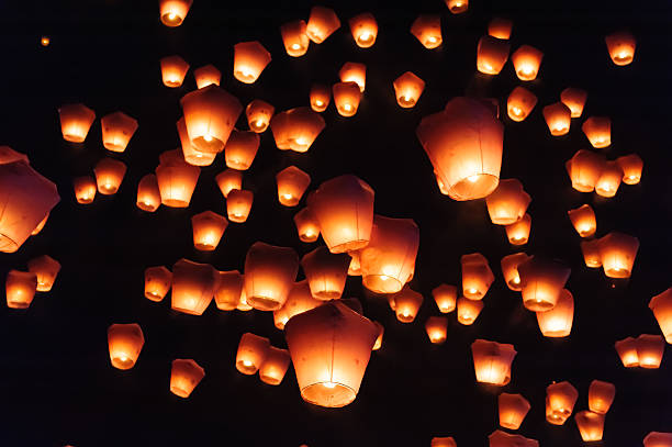 Sky lanterns against the sky with blue tone