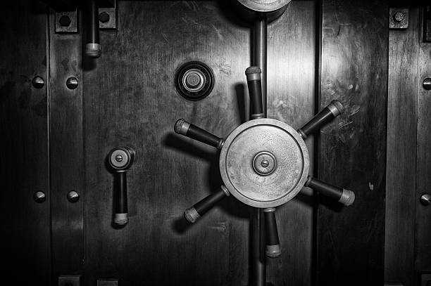 Vault Door - Black and White Steel vault / safe door - black and white. unlocking photos stock pictures, royalty-free photos & images