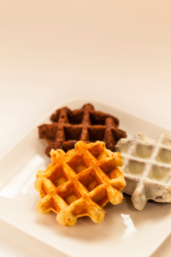 Three kinds of waffles on the white dish.