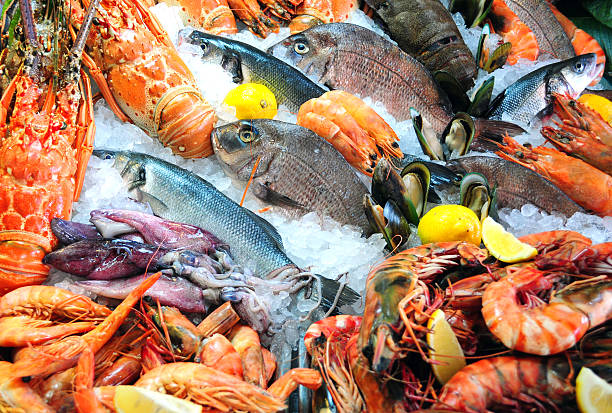 Fresh seafood Variety of fresh seafood on ice crustacean stock pictures, royalty-free photos & images