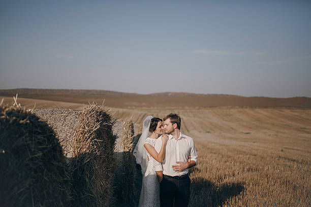 istock happy wedding couple in a field 470982832