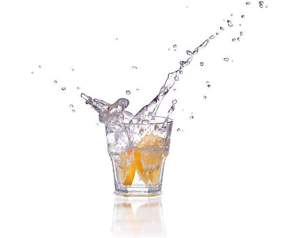 istock Orange or lemon slice fall in glass with water splash 470984860