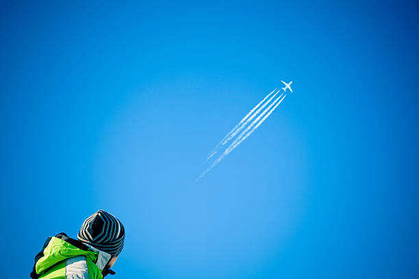 Two contrails. Airplane trail in the clear blue sky
