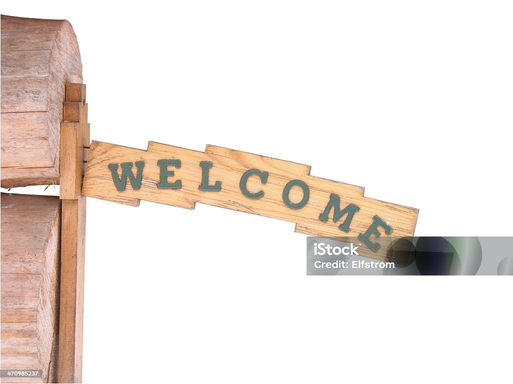 Wooden Welcome Sign A crookedly mounted wooden "Welcome" sign from a cabin in Canada. Knocked out to white for your ease of use. Please let me know where you end up using this image. Carving - Craft Product Stock Photo