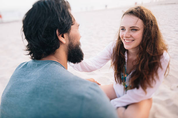 istock Happy couple looking lovingly at each other at the beach 470985804