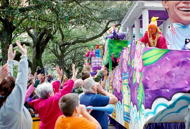 Mardi Gras Parade on St. Charles Ave - New Orleans. The crowd yells "throw me something mister" at the Krewe.