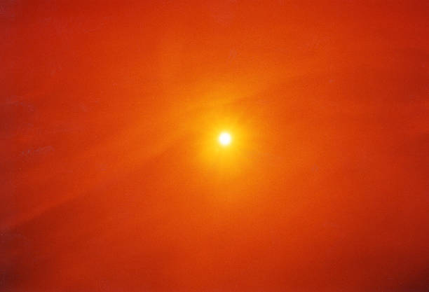 Sun through orange filter The sun taken through an orange filter. Aflame stock pictures, royalty-free photos & images