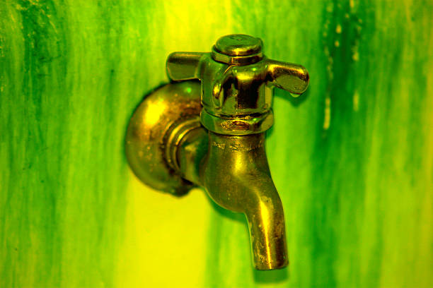 a green dirty faucet stock photo