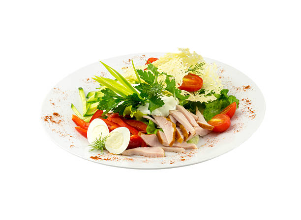 istock Salad with meat, vegetables and quail eggs 470989284
