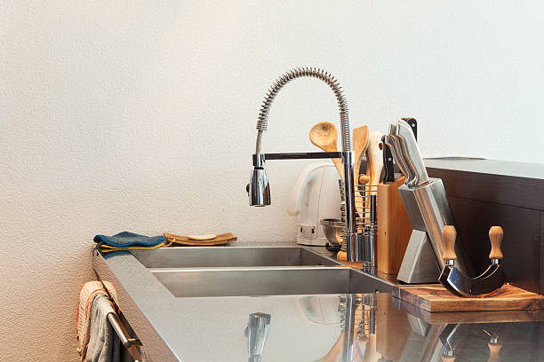 istock Modern kitchen with a stainless steel sink and accessories 470989298