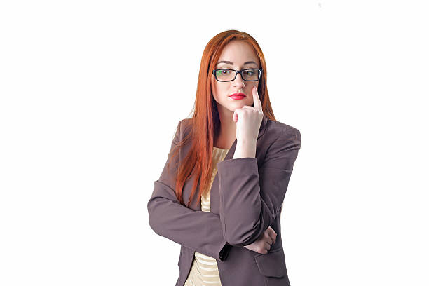 istock thinking redhead business woman with glasses 470990068
