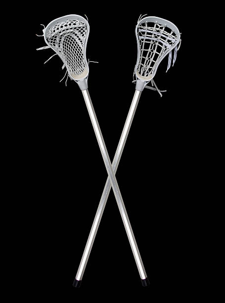 lacrosse sticks crossed (on black) stock photo