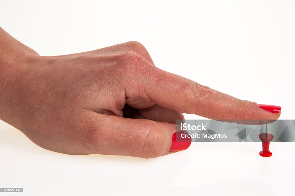 Woman's hand and pin Straight Pin Stock Photo