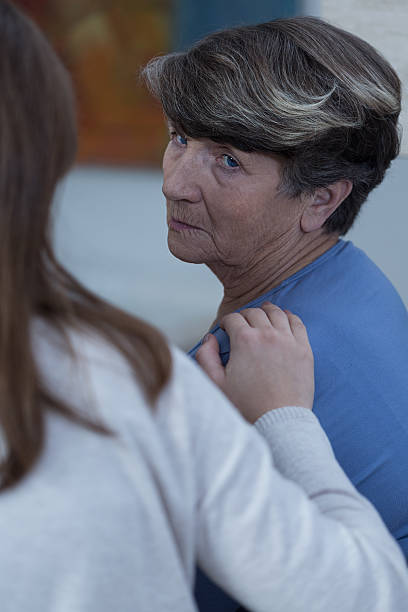 istock Granddaughter assisting her sad grandmother 470991562