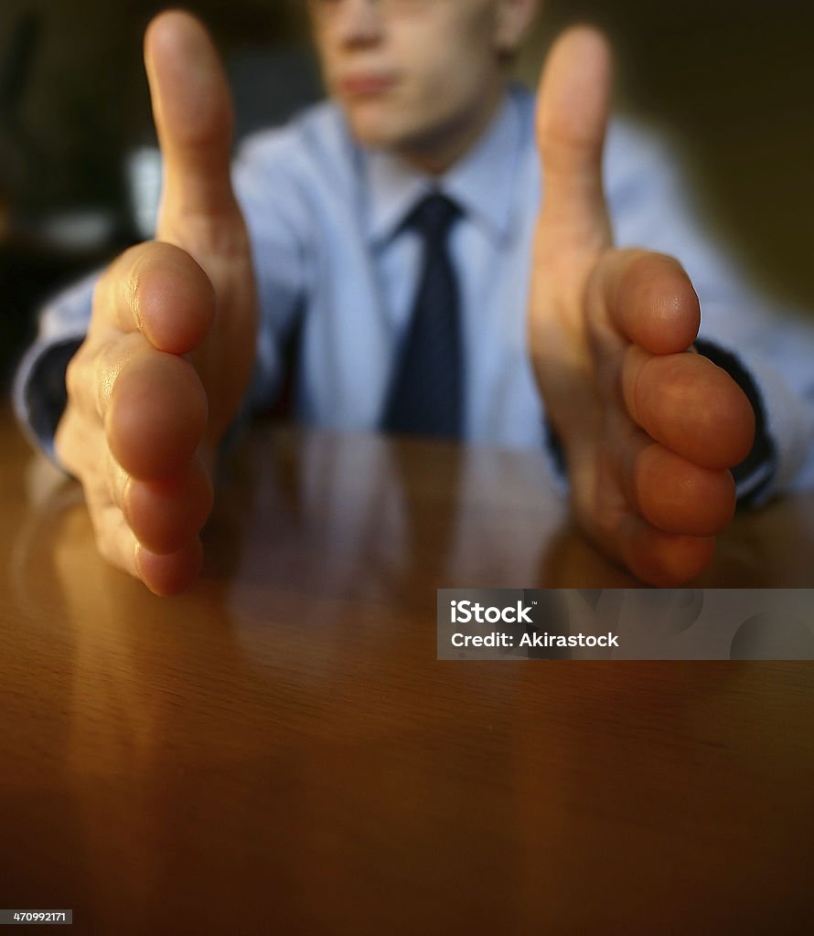 This long! Businessman holding his hands to show "this long/short"  Adult Stock Photo